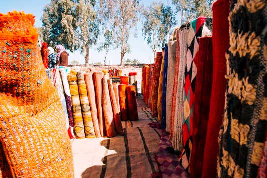 Colorful Moroccan carpets displayed in a shop in Marrakech